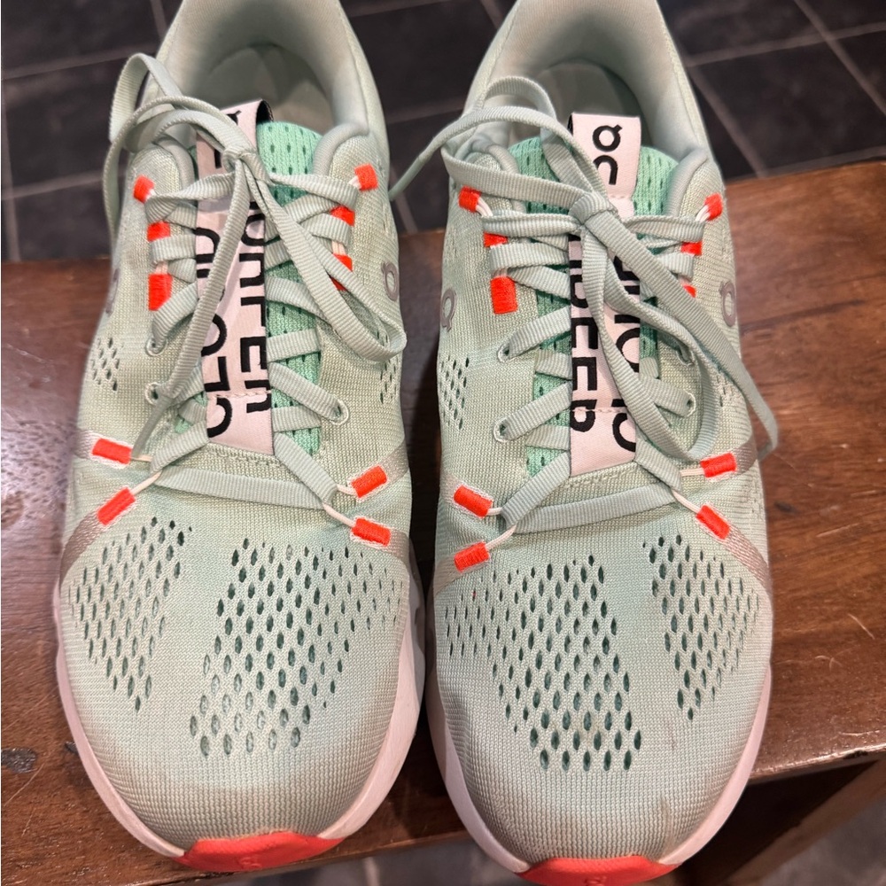 On Running Mint Sneakers with Orange Accents